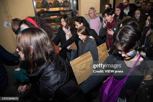 Greta Thunberg, surrounded by other activists, heads towards of the Climate March on December 6, 2019 in Madrid, Spain. Shortly after reaching the...