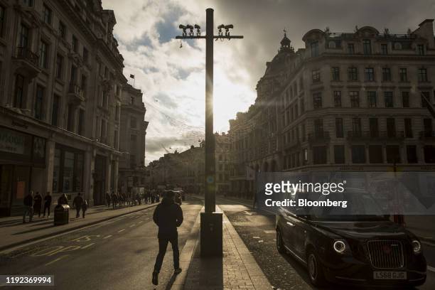 London Cab passes beneath security cameras on Regent Street in central London, U.K. On Monday, Jan. 6, 2020. The Precision Economy is "a future of...
