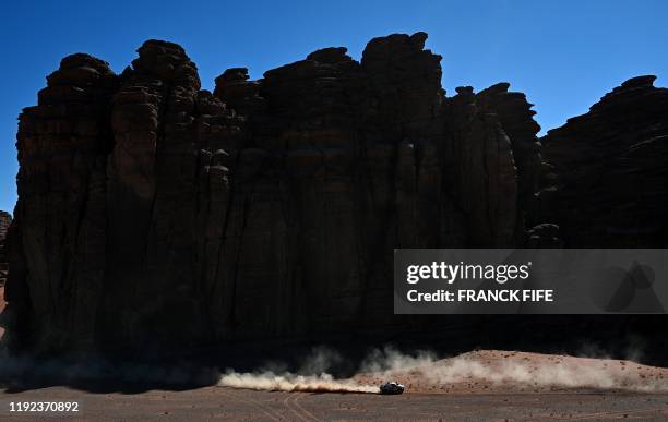 Toyota's driver Nasser Al-Attiyah of Qatar and his co-driver Mathieu Baumel of France compete during the Stage 3 of the Dakar 2020 around Neom, Saudi...