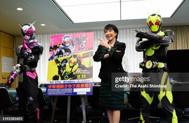 Home Affairs Minister Sanae Takaichi promotes the Boys Fire Club with Kamen Rider Zero-One and Zi-O on December 6, 2019 in Tokyo, Japan.