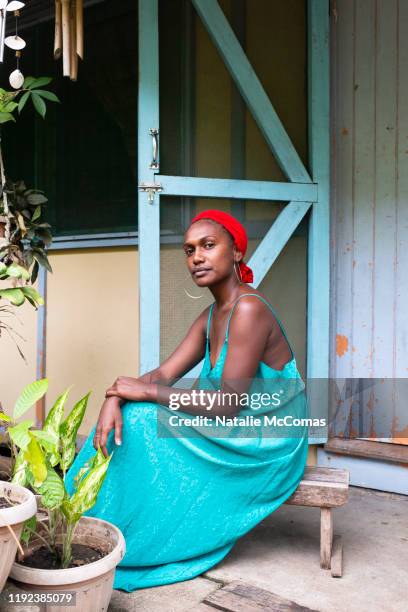 portrait of one young woman outside at home - honiara fotografías e imágenes de stock