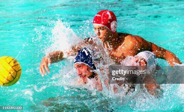 Spanish goalie Jesus Miguel Rollan Prada jumps over Italy's Massimiliano Ferretti and Spanish teammate Jordi Sans Juan during the men's final 09...