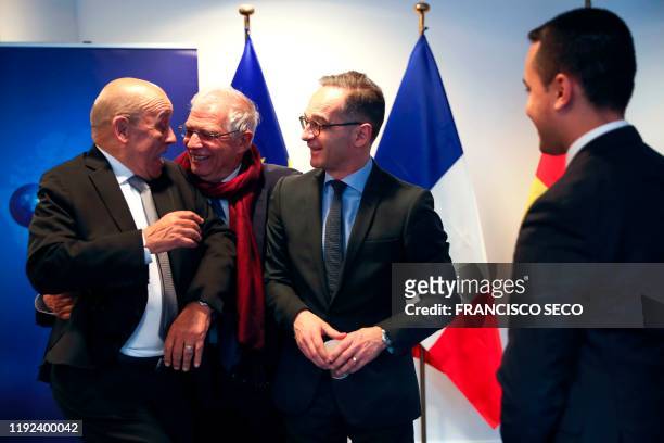 High Representative for Foreign Affairs and Security Policy Josep Borrell reacts with French Foreign Affairs Minister Jean-Yves Le Drian flanked by...
