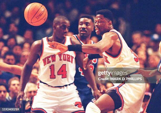 The ball gets away from New York Knicks Patrick Ewing as teammate Anthony Mason blocks out New Jersey Nets Armon Gilliam during the first half of...