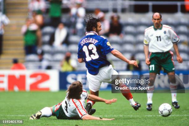 Trifon Ivanov of Bulgaria and Christophe Dugarry of France during the European Championship match between France and Bulgaria at St James Park,...