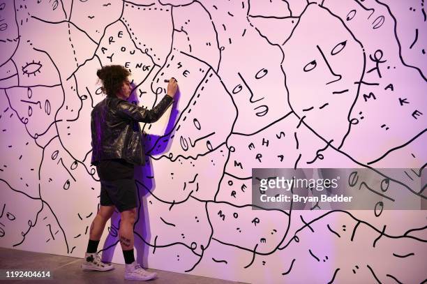 Shantell Martin creates a live art piece during HBO's Human By Orientation panel at Art Basel Miami at Rubell Family Collection on December 06, 2019...