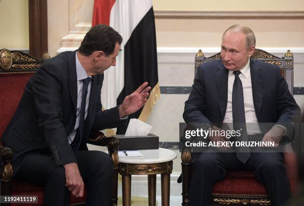 Russian President Vladimir Putin and Syrian President Bashar al-Assad hold a meeting in Damascus on January 7, 2020. Putin met his Syrian counterpart...