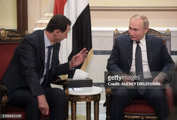 Russian President Vladimir Putin and Syrian President Bashar al-Assad hold a meeting in Damascus on January 7, 2020. Putin met his Syrian counterpart...