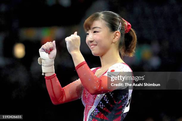 Asuka Teramoto of Japan celebrates after competing in the Balance Beam in the Women's Team Qualification during day two of the FIG Artistic...