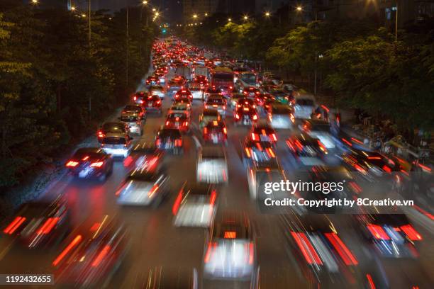 traffic jam with blur light motion in rush hours. - hanoi night stock-fotos und bilder