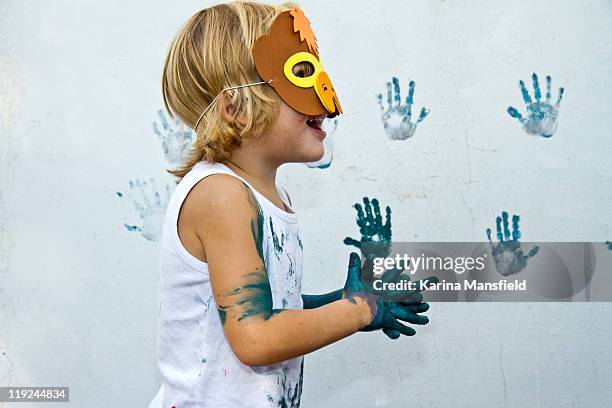 boy having fun - paint handprint stock pictures, royalty-free photos & images