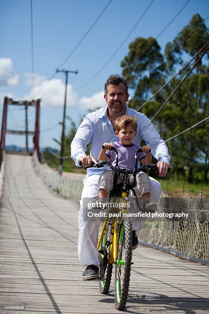 Father and son riding bicycle