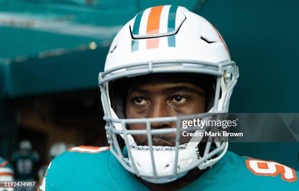 Taco Charlton of the Miami Dolphins looks on prior to the game against the Philadelphia Eagles at Hard Rock Stadium on December 01, 2019 in Miami,...