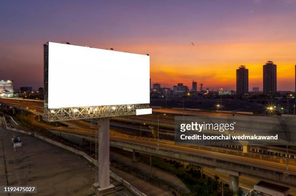 blank billboard for outdoor advertising at twilight time - highway billboard stock pictures, royalty-free photos & images