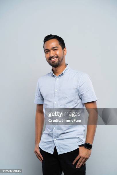 portrait of a successful malay muslim man - malay people stock pictures, royalty-free photos & images