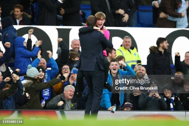 Interim Everton Manager, Duncan Ferguson celebrates his team's third goal with a ball boy during the Premier League match between Everton FC and...