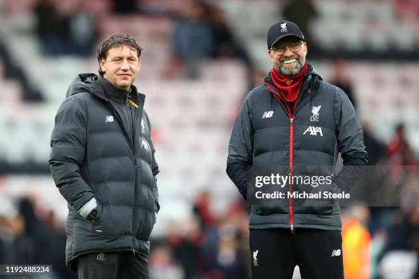 Jurgen Klopp, Manager of Liverpool and assistant coach Peter Krawietz look on as his team warm up prior to the Premier League match between AFC...