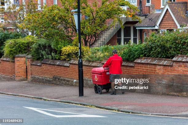 postal delivery - postal worker stock pictures, royalty-free photos & images