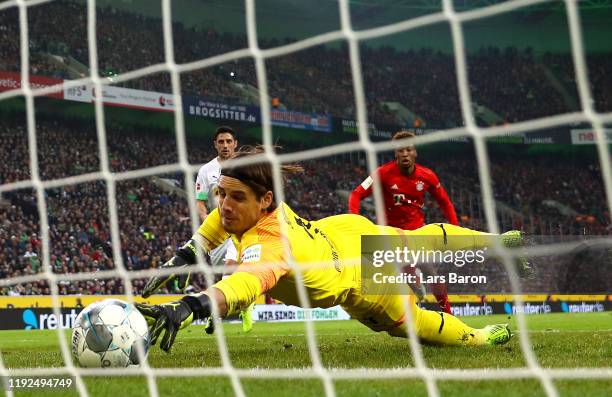 Yann Sommer of Borussia Monchengladbach dives to make a save on the line during the Bundesliga match between Borussia Moenchengladbach and FC Bayern...