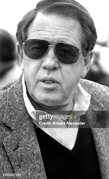 Bill France Jr., the chief executive officer of NASCAR, talks with reporters in the speedway garage prior to the start of the 1988 Daytona 500 NASCAR...