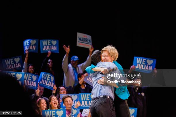 Senator Elizabeth Warren, a Democrat from Massachusetts and 2020 presidential candidate, right, hugs Julian Castro, former secretary of Housing and...