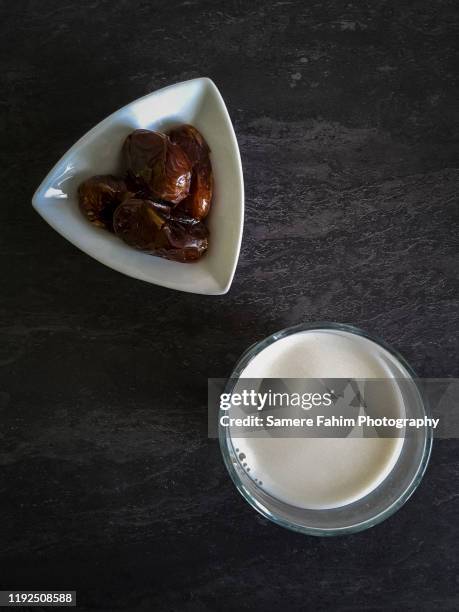 dates and a glass of milk on a table - dates fruit stock pictures, royalty-free photos & images