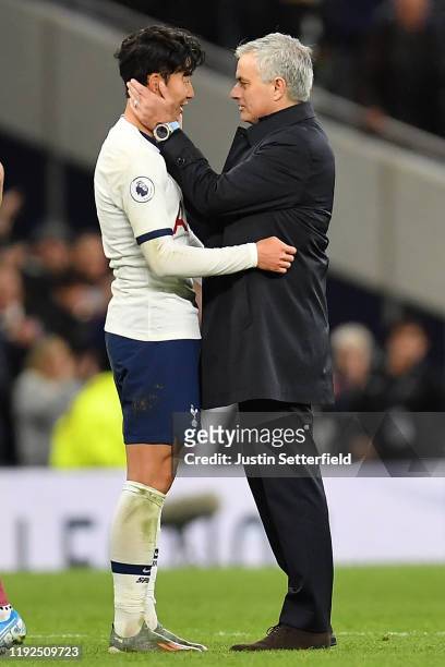 Jose Mourinho, Manager of Tottenham Hotspur embraces Heung-Min Son of Tottenham Hotspur following victory in the Premier League match between...