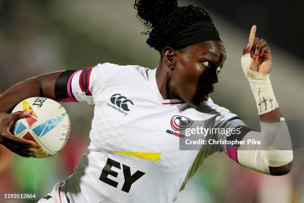 Cheta Emba of USA gestures while running with the ball for a try during the Women's Bronze Medal Final match between USA and Australia on Day Three...