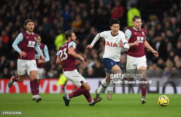 Heung-Min Son of Tottenham Hotspur breaks past Erik Pieters of Burnley to go on and score his team's third goal during the Premier League match...