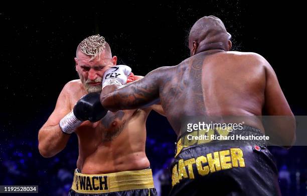 Dillian Whyte punches Mariusz Wach during the Heavyweight fight between Dillian Whyte and Mariusz Wach during the Matchroom Boxing 'Clash on the...