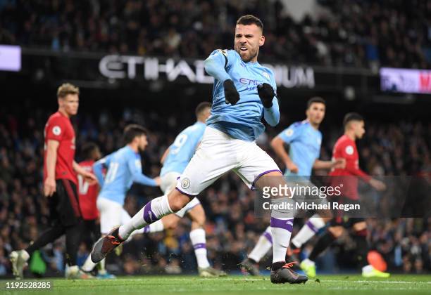 Nicolas Otamendi of Manchester City celebrates after scoring his team's first goal during the Premier League match between Manchester City and...