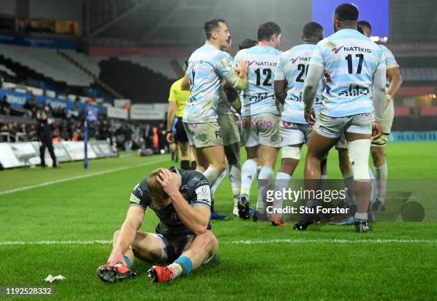 Ospreys scrum half Aled Davies reacts after Racing celebrate a try by captain Henry Chavancy during the Heineken Champions Cup Round 3 match between...