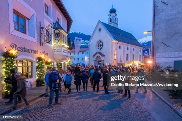 Tourists and locals visit the Christmas market in Glorenza on December 7, 2019 in Bolzano, Italy. The Glorenza Christmas Market is open from 6 -8...