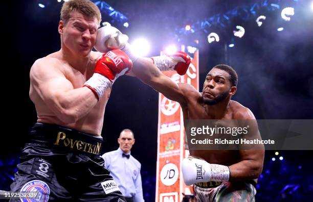 Michael Hunter punches Alexander Povetkin during the of the WBC World Heavyweight Elimnator fight between Alexander Povetkin and Michael Hunter...