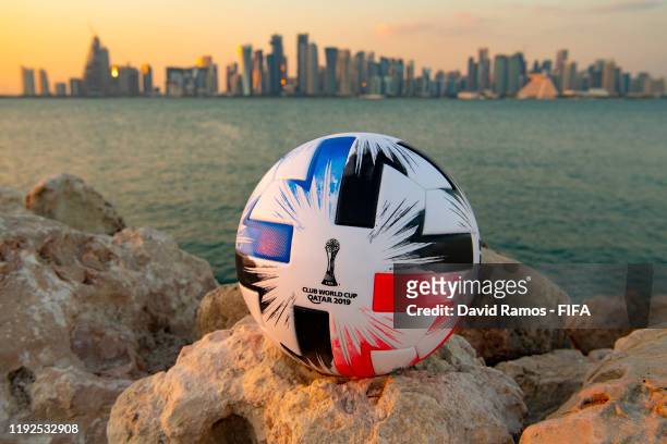 In this photo illustration an Official FIFA Club World Cup Qatar 2019 ball sits on display in front of the skyline of Doha on December 07, 2019 in...