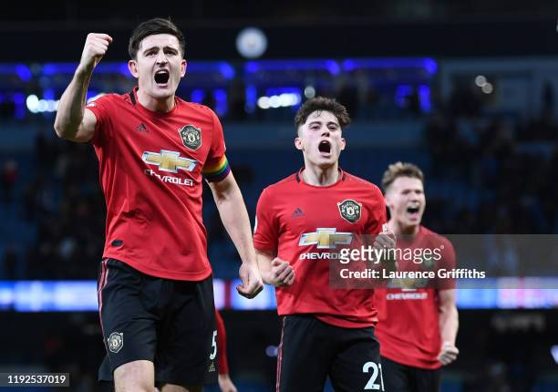 Harry Maguire and Daniel James of Manchester United celebrate following their sides victory during the Premier League match between Manchester City...