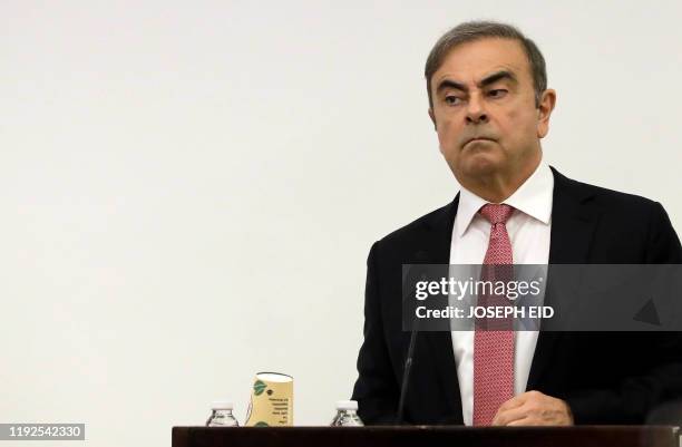 Former Renault-Nissan boss Carlos Ghosn addresses a large crowd of journalists on his reasons for dodging trial in Japan, where he is accused of...