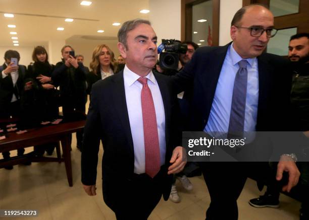 Former Renault-Nissan boss Carlos Ghosn arrives at the Lebanese Press Syndicate to address a large crowd of journalists on his reasons for dodging...