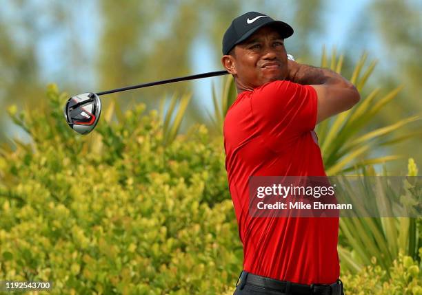 Tiger Woods of the United States hits is tee shot on the 11th hole during the final round of the Hero World Challenge at Albany on December 07, 2019...