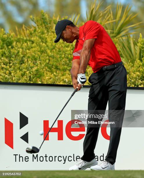 Tiger Woods of the United States hits is tee shot on the 11th hole during the final round of the Hero World Challenge at Albany on December 07, 2019...