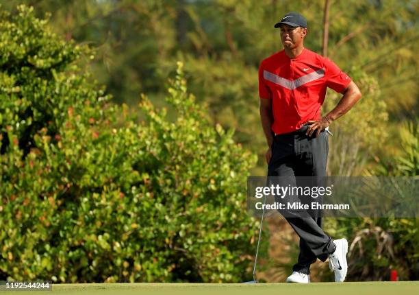 Tiger Woods of the United States lines up a putt on the 12th hole during the final round of the Hero World Challenge at Albany on December 07, 2019...