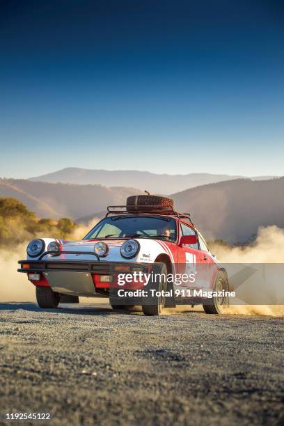 Porsche 911 SC sports car photographed driving in the hills outside San Diego, California, on September 26, 2018.