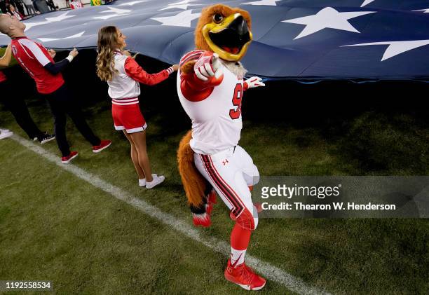 Utah Utes mascot "Swoop" displays the American flag with students prior to the start of the Pac-12 Championship football game against the Oregon...