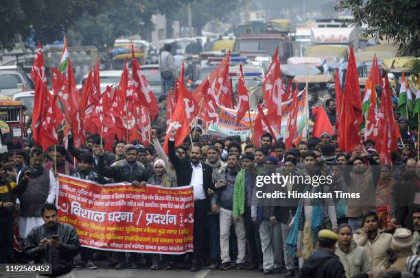 Members of Centre of Indian Trade Unions seen during a protest on 24-hour Bharat Bandh called by different trade unions against the anti-labour...
