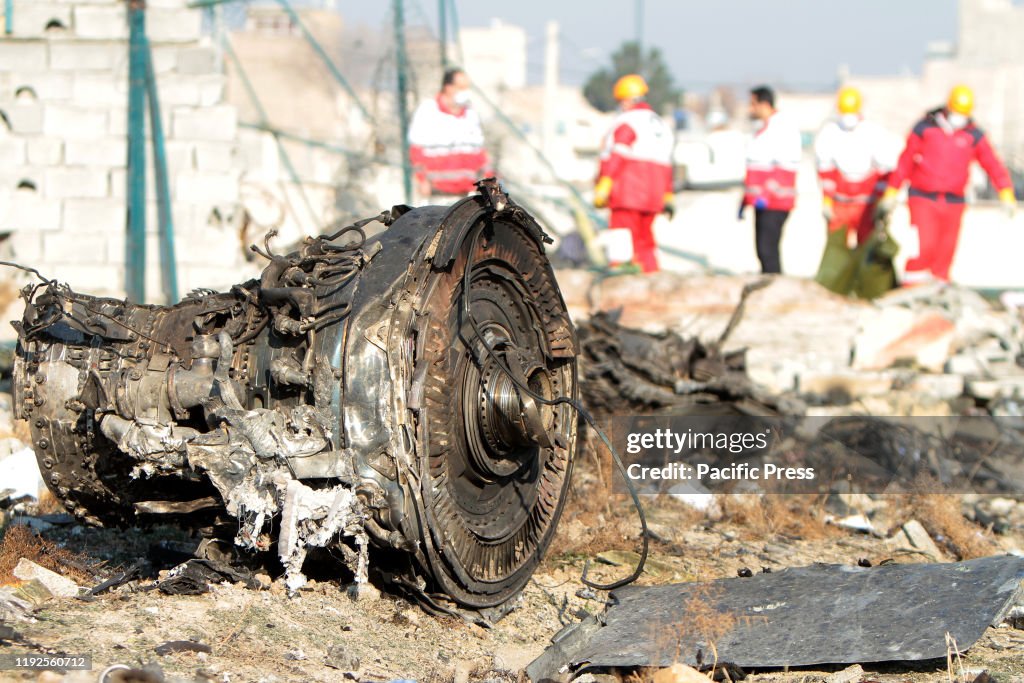 Rescue team at the crash site of a Ukrainian airliner that...