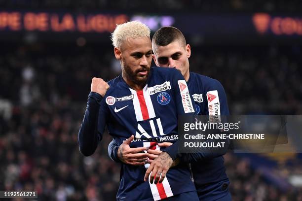 Paris Saint-Germain's Brazilian forward Neymar celebrates with Paris Saint-Germain's Italian midfielder Marco Verratti after scoring a goal during...
