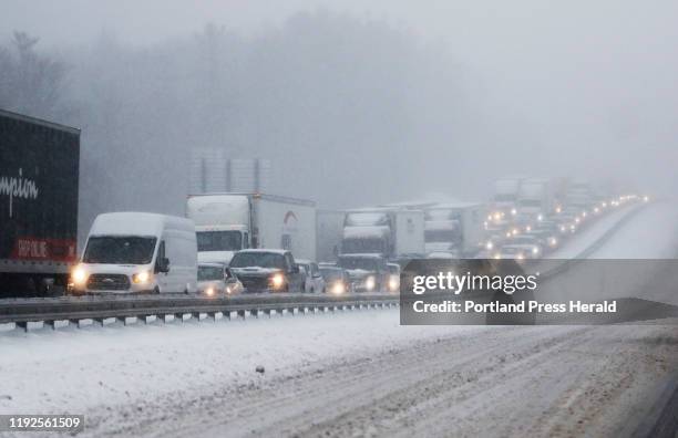 Northbound traffic on I-95 is at a standstill following a tractor trailer that jack-knived in the snowstorm.