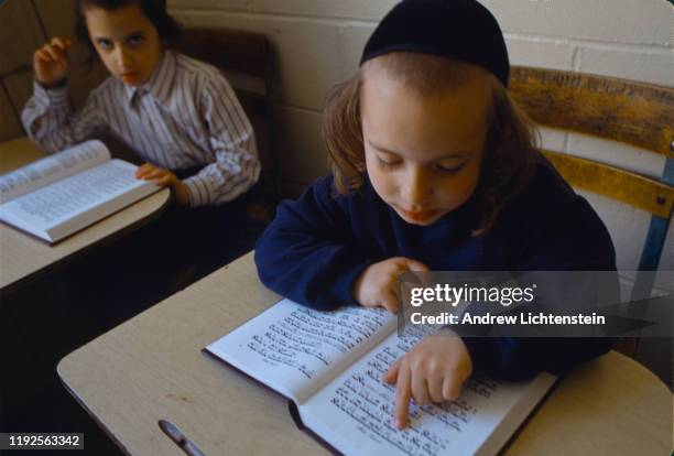 S: Young Satmar yeshiva students study the Torah in the 1990's in the Williamsburg neighborhood of Brooklyn, New York. The Satmar are an anti-zionist...