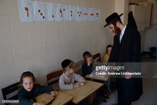 S: Young Satmar yeshiva students study the Torah in the 1990's in the Williamsburg neighborhood of Brooklyn, New York. The Satmar are an anti-zionist...