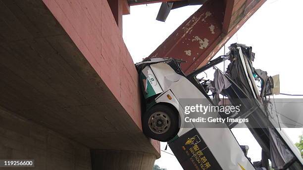 Bus lies crumpled on the ground after The Wuyishan Gongguan Bridge collapsed on July 14, 2011 in Wuyishan, Fujian province of China. One person was...